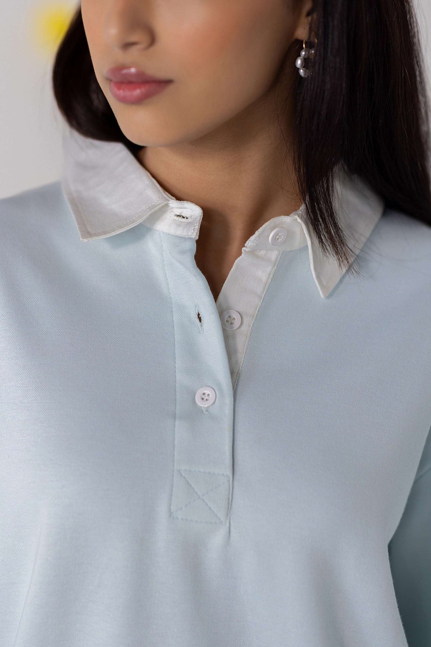 COZY Ladies Rugby Polo in light blue, featuring a classic collar and a relaxed fit for comfortable wear.