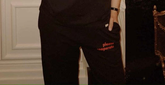 "please cooperate" Flared Pants