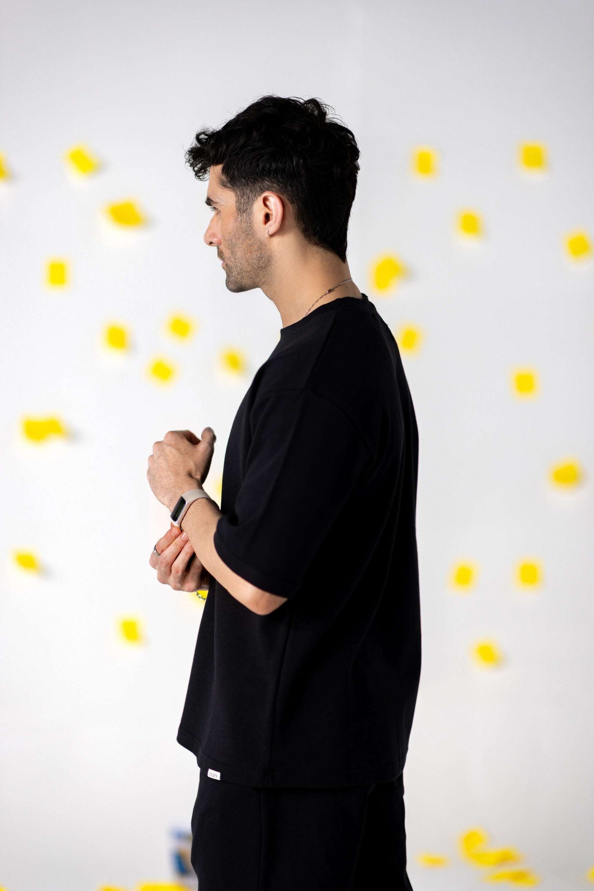 Model showcasing COZY Shorts V2 in relaxed fit, made with organic cotton, perfect for fall attire.