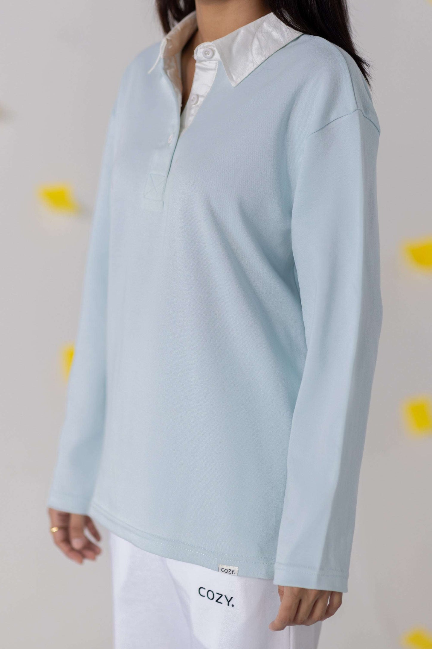 COZY Ladies Rugby Polo in soft blue featuring a relaxed fit and classic rugby-inspired design.