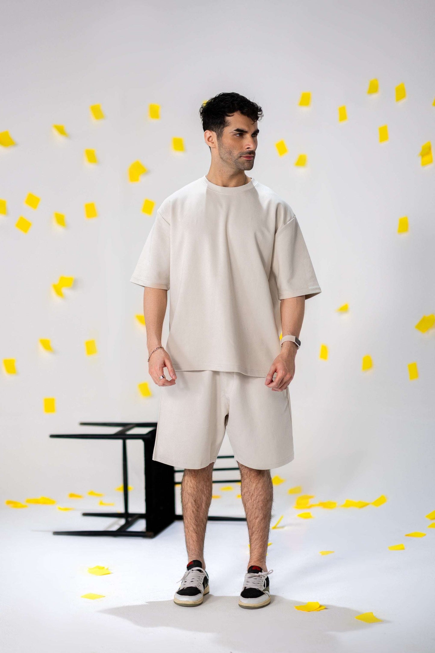 Model wearing COZY Shorts V2, showcasing relaxed fit and organic cotton design against a playful background.