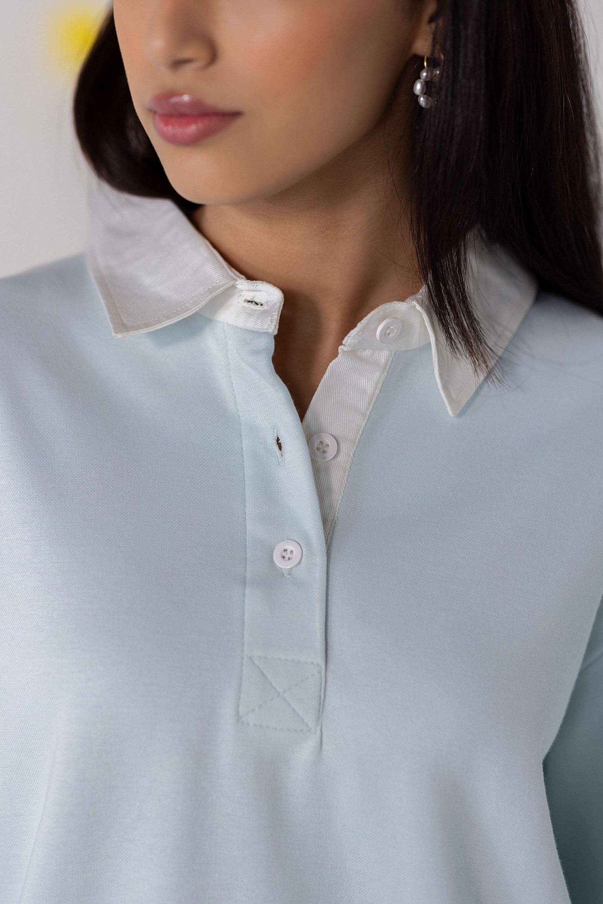 COZY Ladies Rugby Polo in light blue, featuring a classic collar and a relaxed fit for comfortable wear.