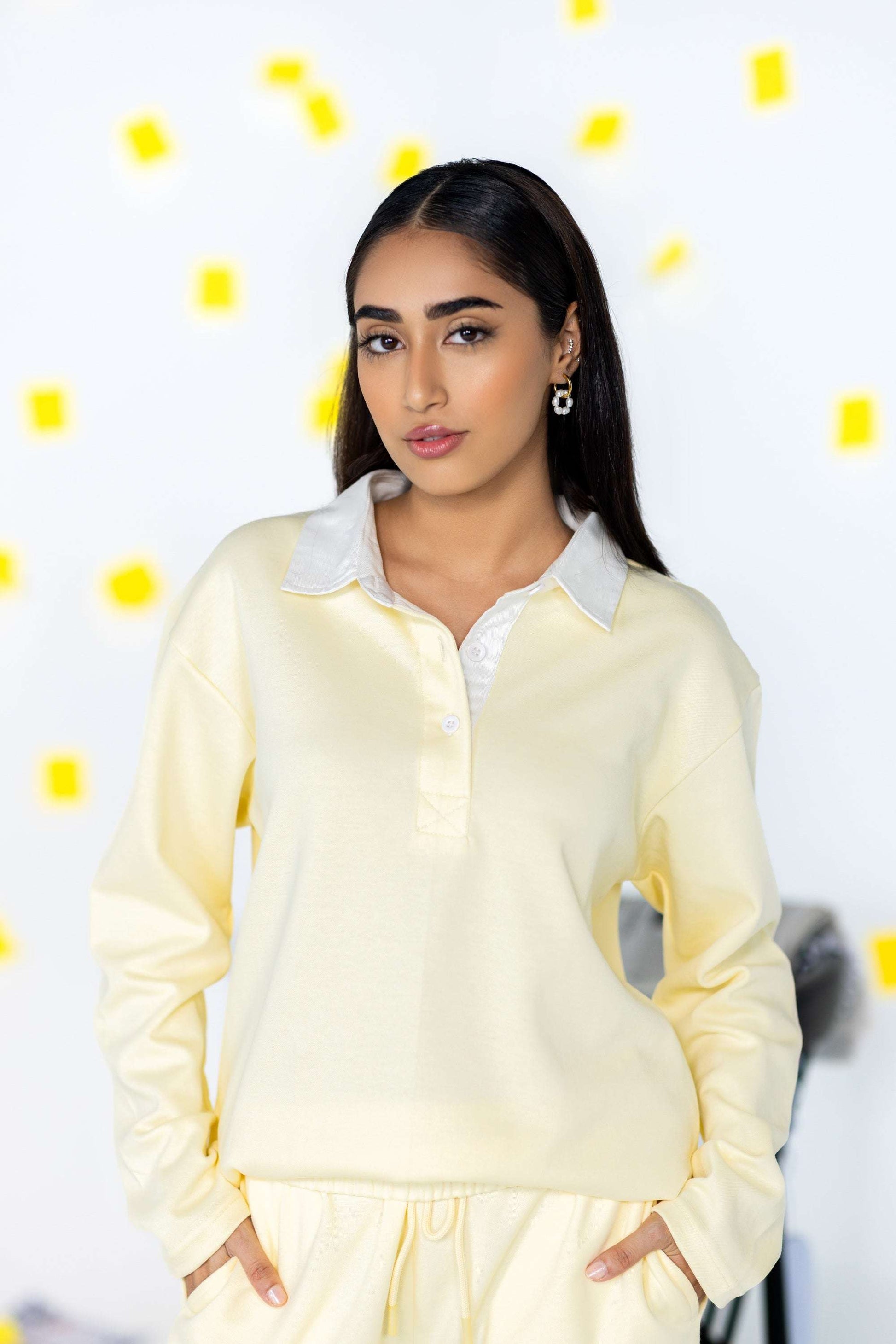 COZY Ladies Rugby Polo in soft yellow with a relaxed fit, featuring a classic rugby collar and modern style.