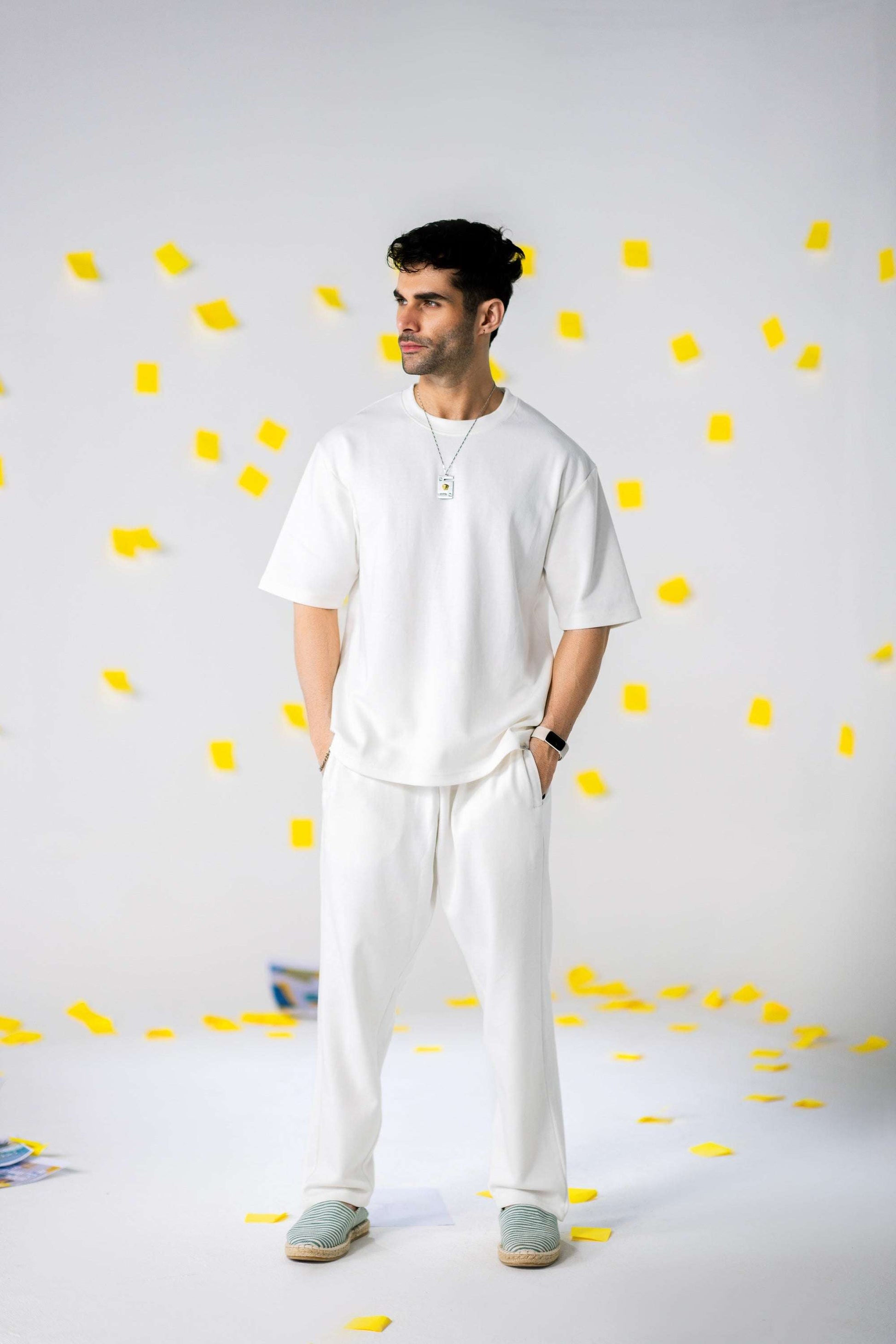 COZY Men's Classic Fit Pants styled with a soft breathable white t-shirt on model in a playful setting.