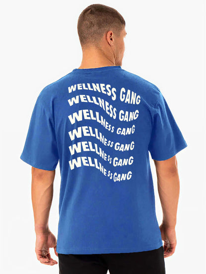 Blue men's Wellness Gang t-shirt made of 100% cotton, showcasing playful graphic design on the back.