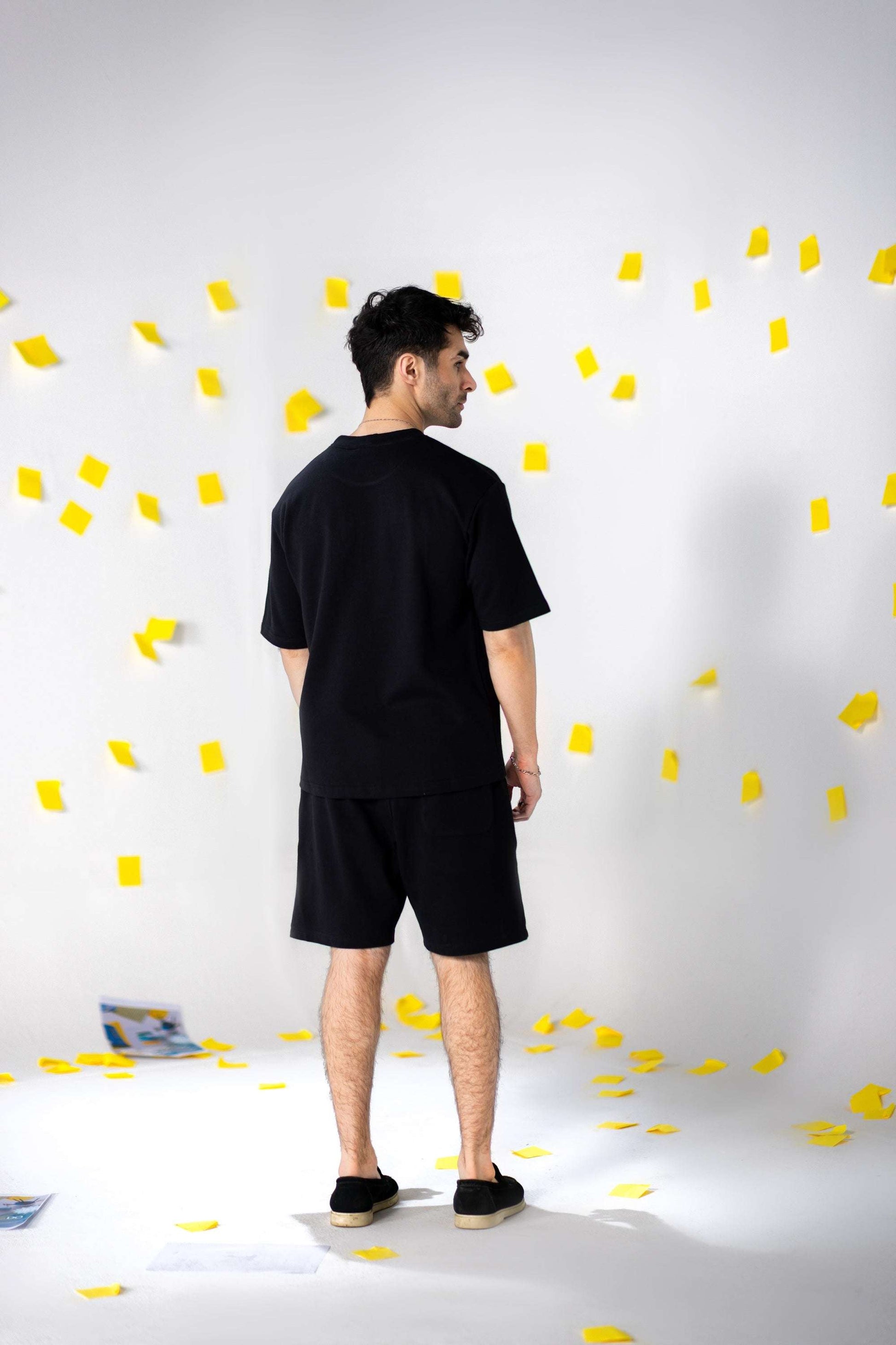 COZY Shorts V2 in relaxed fit, featuring a stylish look and soft organic cotton fabric against a playful backdrop.