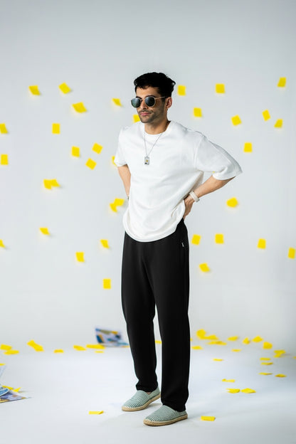 COZY Men's Classic Fit Pants worn by a model, showcasing soft breathable style in a vibrant setting.