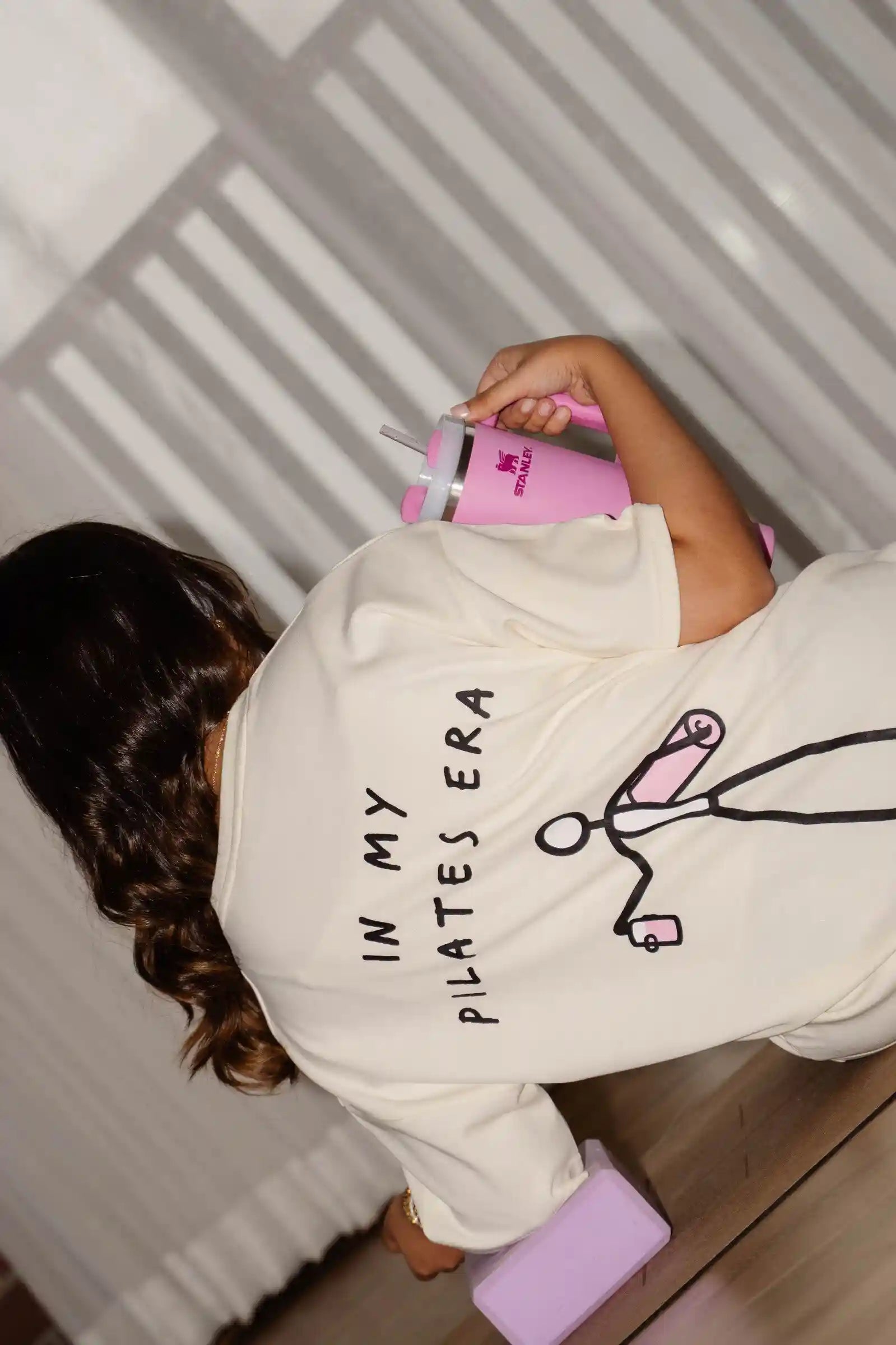 In My Pilates Era oversized tee in COZY Cotton, back print candid top-down angle